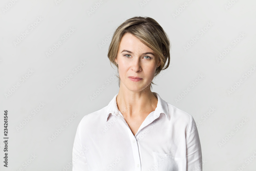 Businesswoman studio portrait. Confidence woman in white shirt isolated on white Businesswoman studio portrait. Confidence woman in white shirt isolated on white