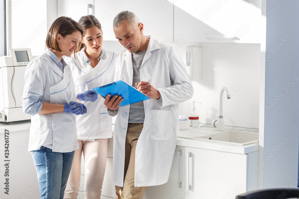 A group of skilled dentists comes together in a dental office, combining their expertise and compassion to provide exceptional oral care and create healthy smiles for their patients. A group of skilled dentists comes together in a dental office, combining their expertise and compassion to provide exceptional oral care and create healthy smiles for their patients.