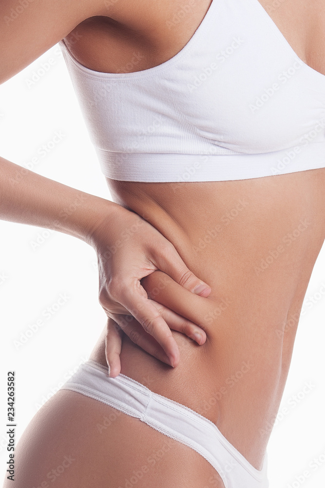 Fototapeta premium Woman shows percentage of fat. Isolated on white