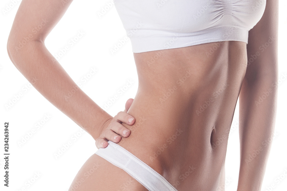 Fototapeta premium Beautiful body of slender girl in front close-up. Isolated on white