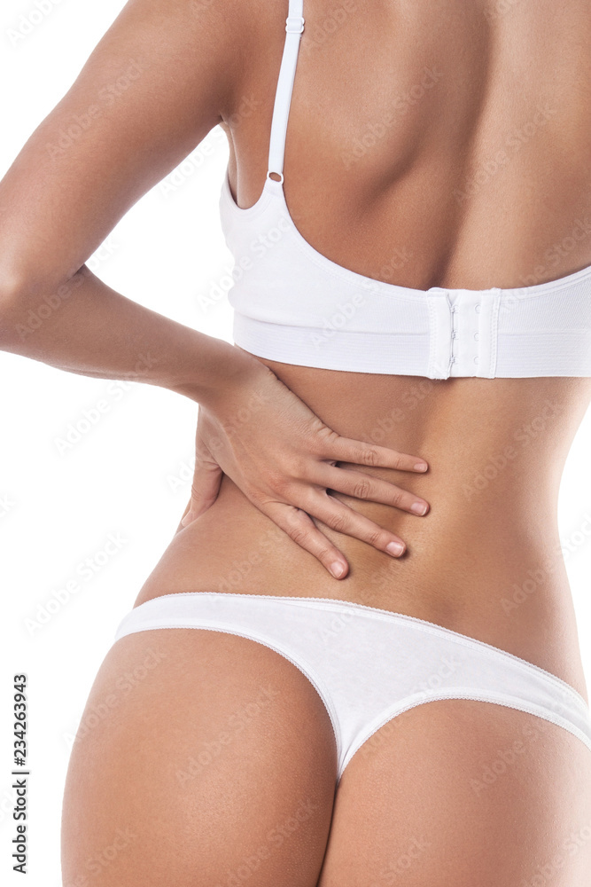 Body of slender girl from behind close-up. Isolated on white Body of slender girl from behind close-up. Isolated on white