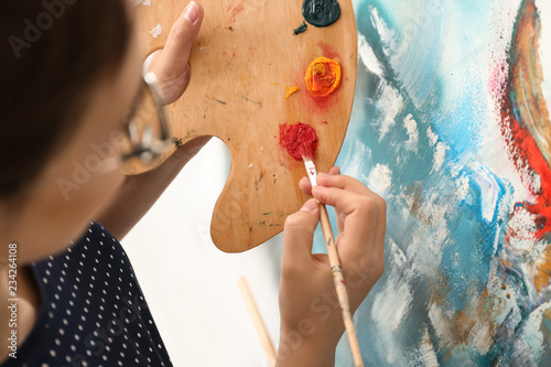 Female artist painting pict...