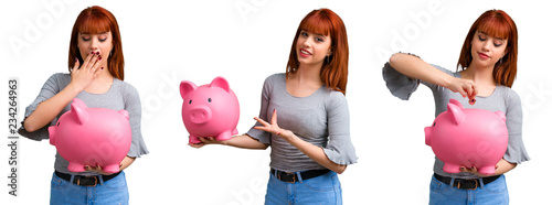 Set of Young redhead girl holding a big piggybank photo