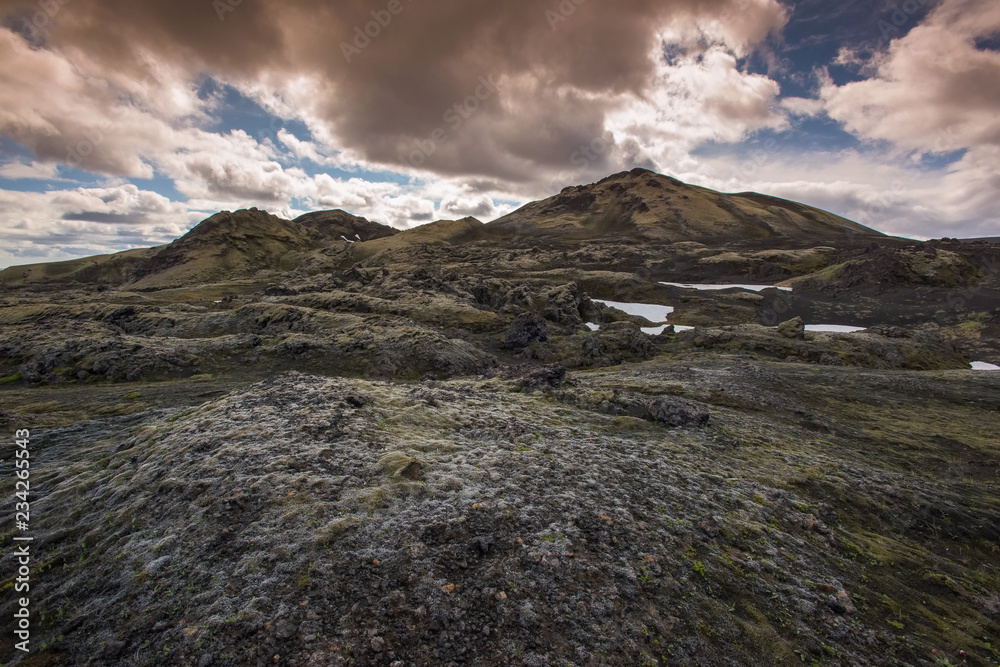 Lakagígar or Laki - Craters of Laki is a volcanic fissure in the south of Iceland with blue and cloudy sky