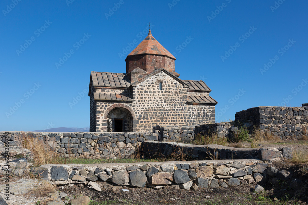 Scenic view of an old Sevanavank church in Sevan, Armenia on sunny  day, blue sky