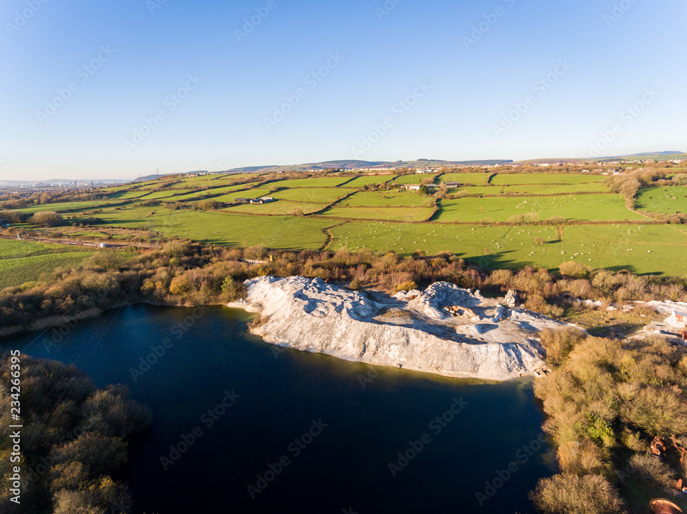 Abandoned lime quarry, buildings and machinery in Bridgend, South Wales, Uk