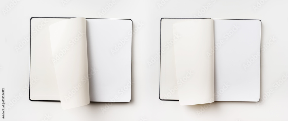 Top view of black notebook with curl rolled page