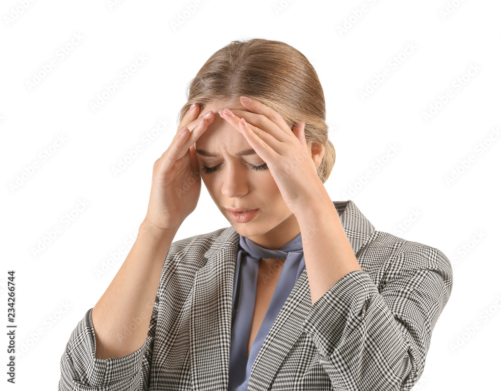 Young woman suffering from headache on white background