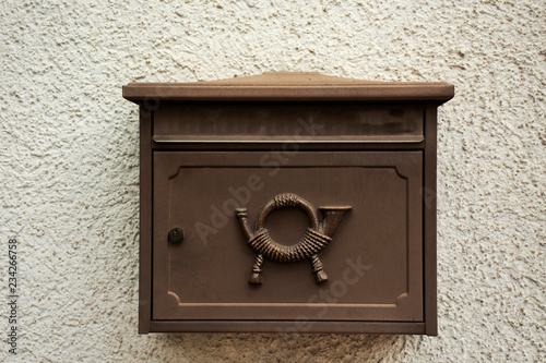 Classic retro letter box on thw wall at home at Sandhausen village in Heidelberg, Germany photo