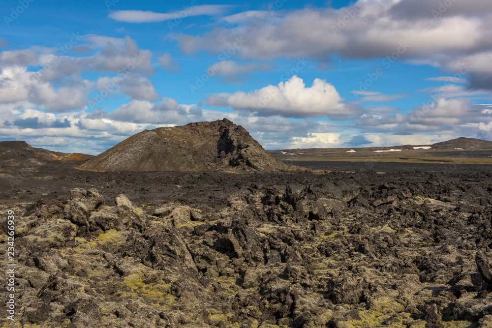 The Krafla is volcanic area in Iceland. Amazing lava field and dramatic sky with dark clouds.