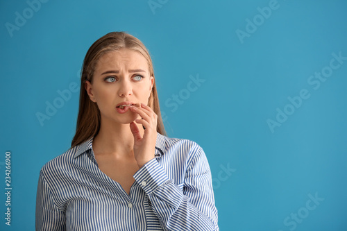 Emotional young woman after...