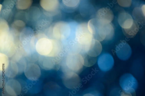 Bokeh photo. Holiday background. Christmas lights. background. Defocused sparkles. New Year backdrop. Festive wallpaper. Blinks. Carnival. Retro style photo.