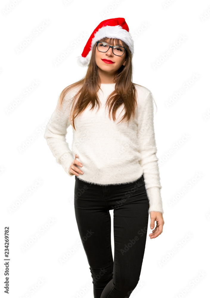 Girl with celebrating the christmas holidays posing with arms at hip and smiling on isolated white background Girl with celebrating the christmas holidays posing with arms at hip and smiling on isolated white background