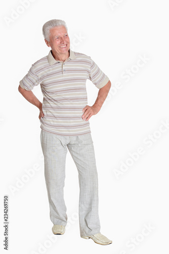 Portrait of senior man posing on white background