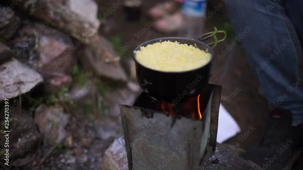 Food is cooked on the fire. Cooking in the campaign. Tourism. Fire in the woods. Lentils cooked on the fire. Food is cooked on the fire. Cooking in the campaign. Tourism. Fire in the woods. Lentils cooked on the fire.