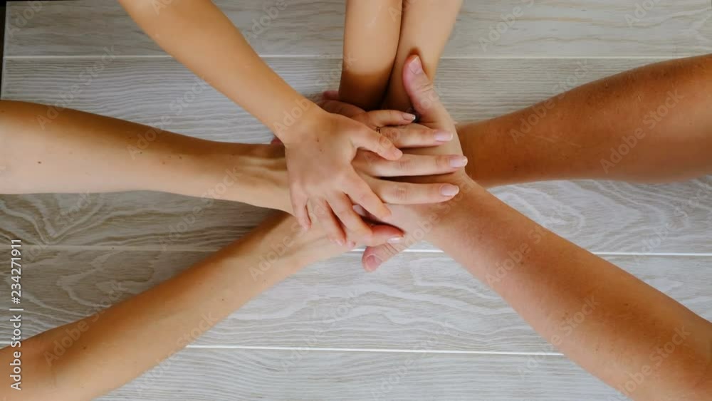 People joining hands, family concept. Top view