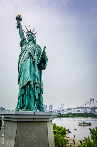 Statue of liberty and tokyo cityscape, Japan © daboost