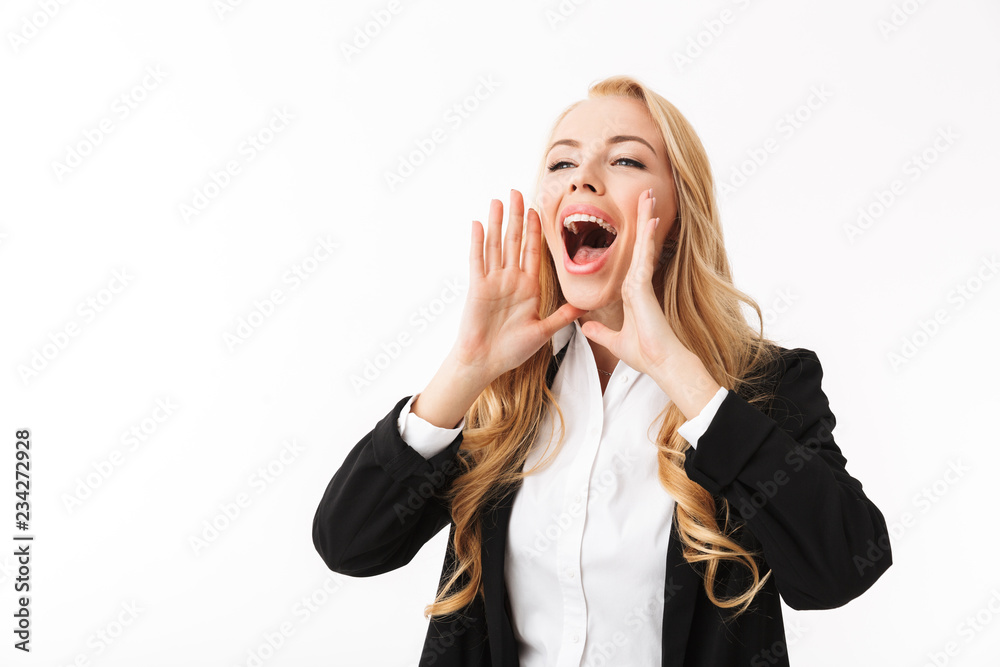 Photo of young businesswoman wearing office suit screaming or calling aside with hands at mouth, isolated over white background in studio Photo of young businesswoman wearing office suit screaming or calling aside with hands at mouth, isolated over white background in studio