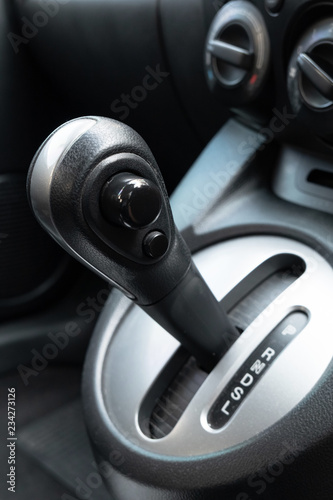 Car gearbox lever in driver place. © Lifestyle Graphic