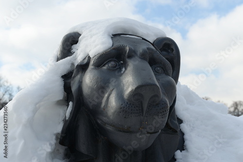 Sculpture of a lion by Zhilardi on the round pier of the Upper Kuzminskogo pond in the park 