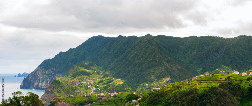 Mountain landscape. View of mountains and sea on route Vereda da Penha de Aguia, Madeira Island, Portugal, Europe.