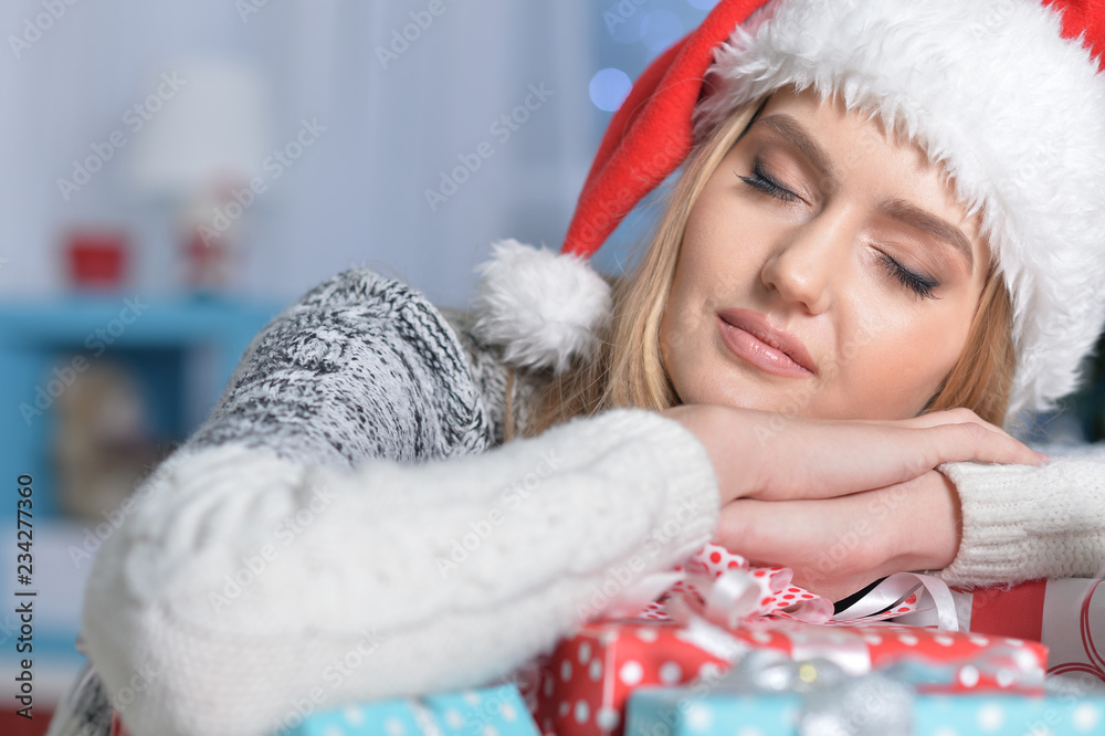 Obraz premium Portrait of cute young woman with present boxes