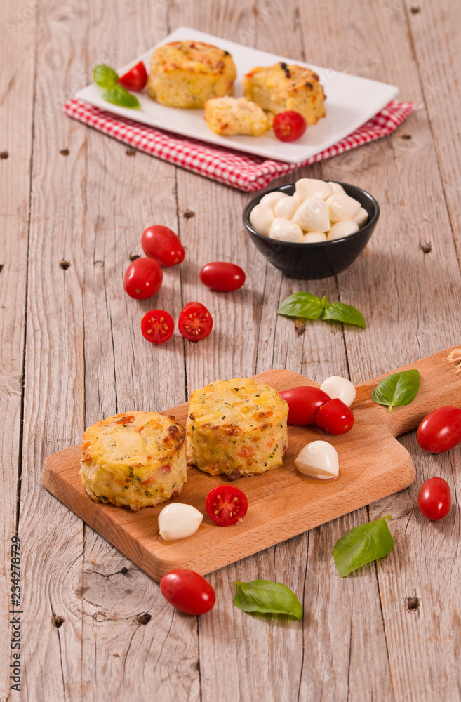 Potato gratins with mozzarella and tomatoes. Potato gratins with mozzarella and tomatoes.