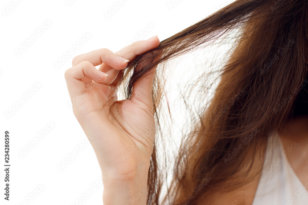 Obraz premium Young woman with problem hair. White background