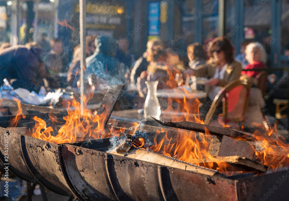 Bonfire with firewood in the restaurant outside