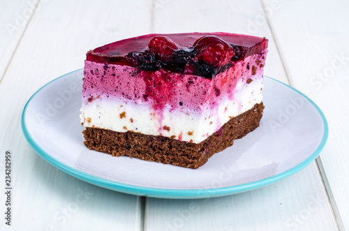 Piece of cake with berries and jelly