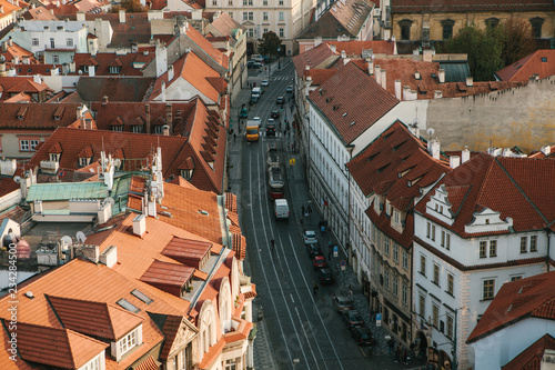 Beautiful aerial view of the traditional old or medieval architecture in Prague in the Czech Republic. Road with cars. Everyday city life.