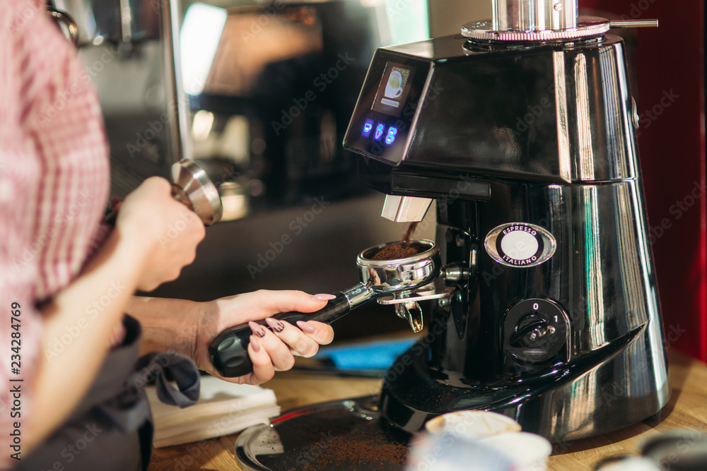 Barista using a coffee machine in cafe - obrazy, fototapety, plakaty 