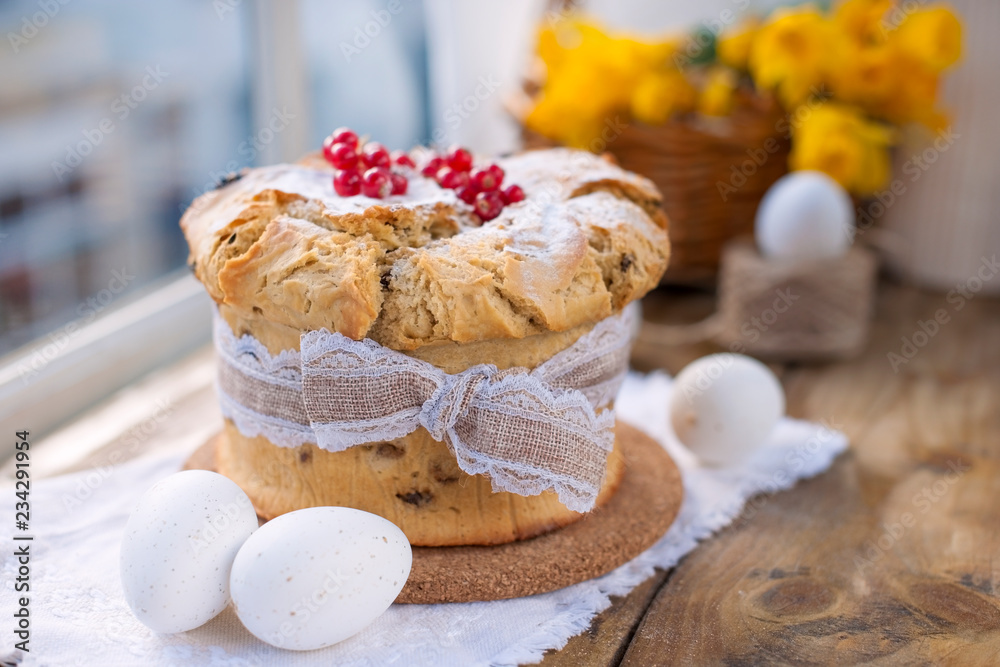 Easter cupcake on the wooden window. Bouquet of spring flowers narcissus. Greeting card for the holiday. Free space for text. Easter cupcake on the wooden window. Bouquet of spring flowers narcissus. Greeting card for the holiday. Free space for text.
