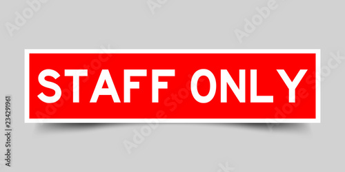 Square red sticker label in word staff only on gray background