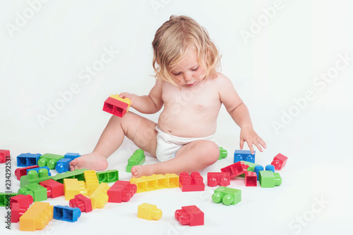 baby girl playing with building blocks