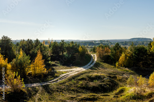 Old sand pit with the road. Man interferes with nature photo