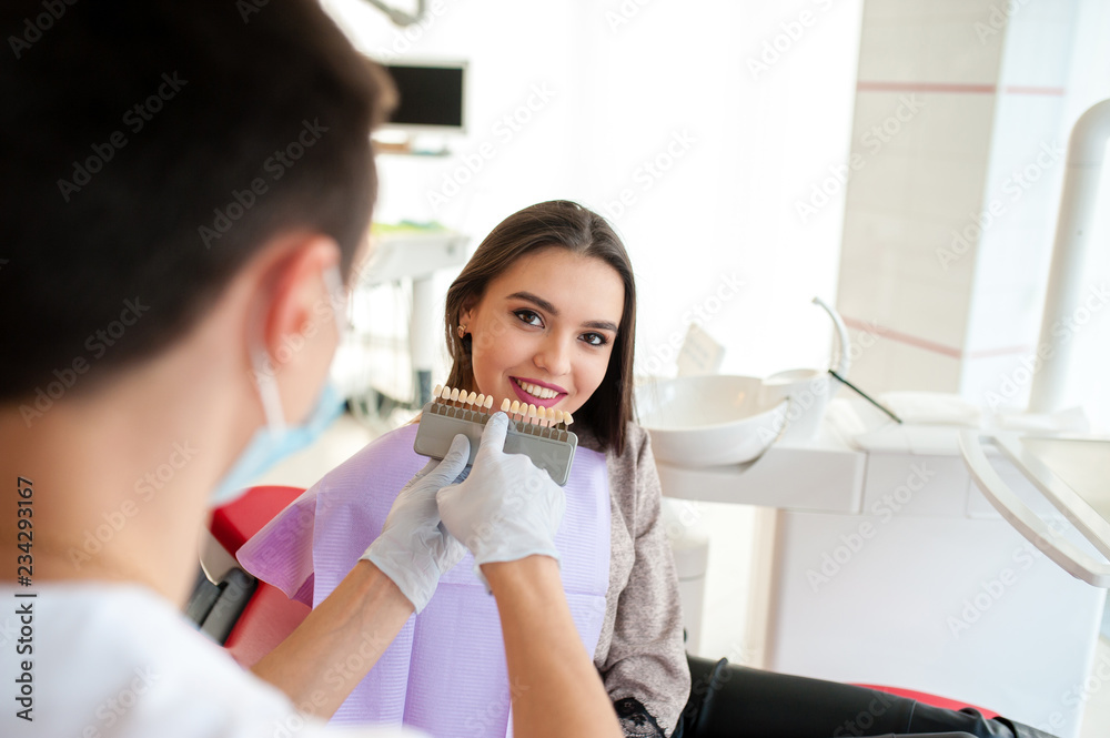 Check and select the color of the teeth for beautiful girl. Check and select the color of the teeth for beautiful girl.