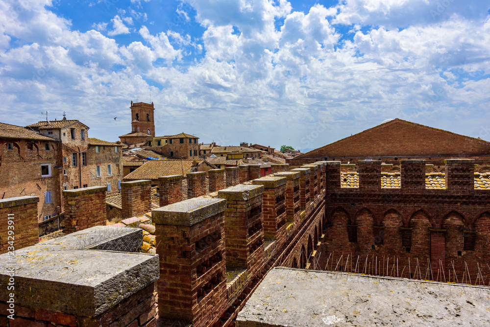 Historic town Siena, Tuscany - Aerial view with beautiful landscape scenery on a sunny summer day, walled medieval hill town with towers in the province of Siena, Italy- Europe Historic town Siena, Tuscany - Aerial view with beautiful landscape scenery on a sunny summer day, walled medieval hill town with towers in the province of Siena, Italy- Europe