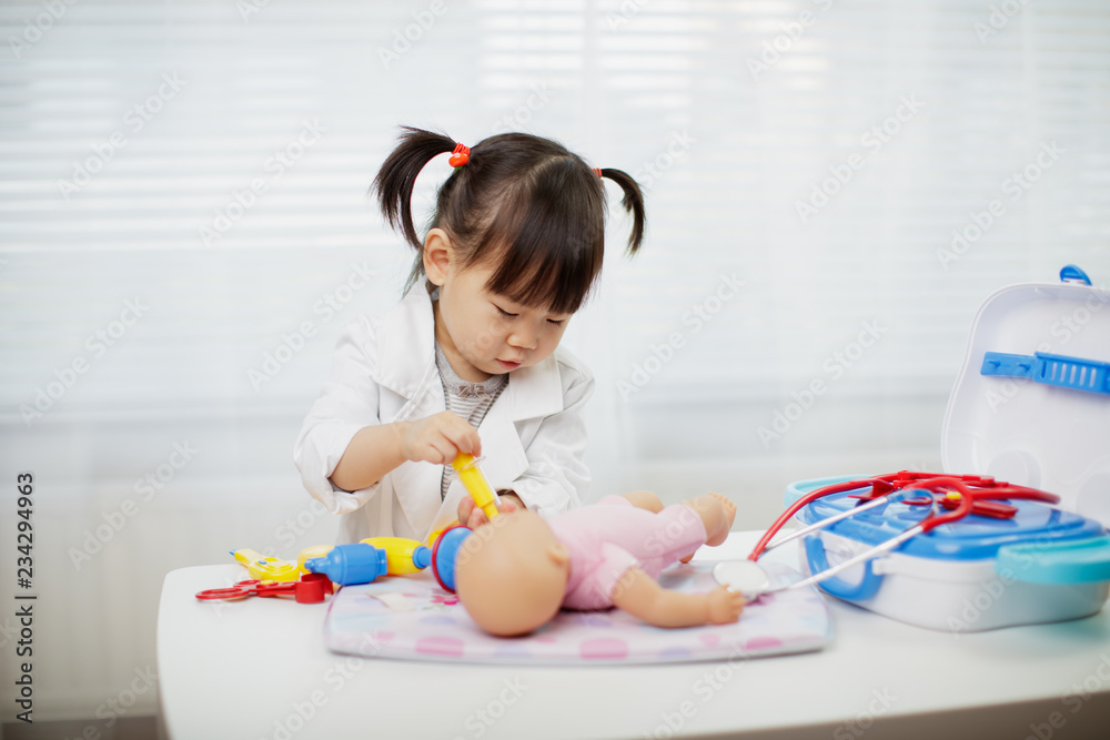 Toddler baby girl pretend playing as doctor at home Toddler baby girl pretend playing as doctor at home