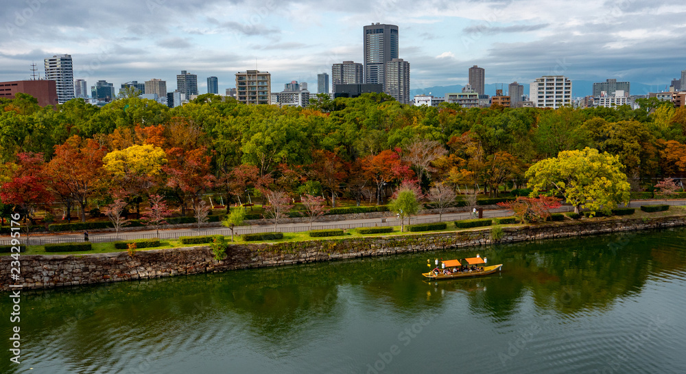 Boat cruise at Osaka Castle Complex in autumn season in Osaka, Japan. Boat cruise at Osaka Castle Complex in autumn season in Osaka, Japan.