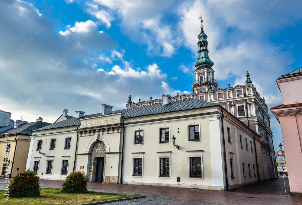 Fototapeta premium Beautiful ancient city office near Town Hall in Zamosc and bright blue sky. Town Zamosc is UNESCO World Heritage List site.