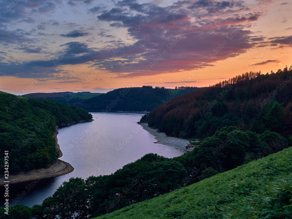 Llyn Brianne Reservoir at Sunset. Built to regulate the river Towy in the Cambrian Mountains mid Wales. A tourist attraction for hikers, fishermen, mountain bikers, bird watchers and horse riders.