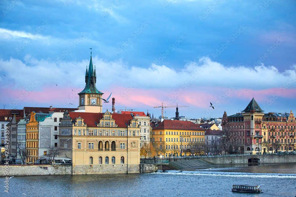 Obraz premium Prague, Czech Republic Beautiful view of the Dvorak embankment, the Vltava river and the old town of Prague. Panorama of the center of Prague, Czech Republic.