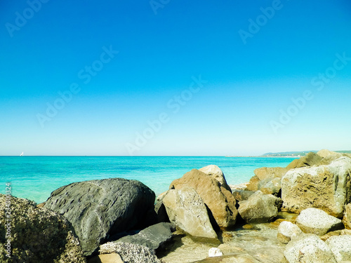 Stones on beach in Vada, Italy.