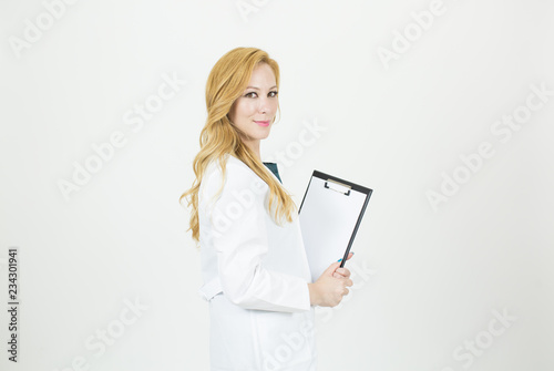 Medical Healthcare Professional Holding Clipboard. Female Doctor Isolated in Uniform. Portrait of a Nurse. Researcher in Science and Biotechnology. Specialist in Medical Health Care Career Training.