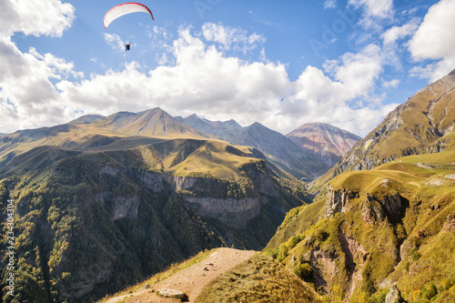 Mountain landscape with paragliders