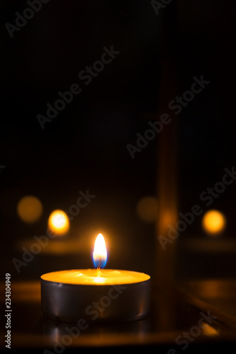 candle flames glowing in the dark