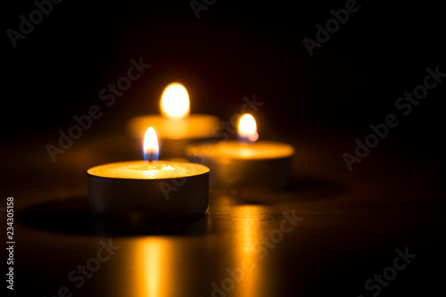 candle flames glowing in the dark