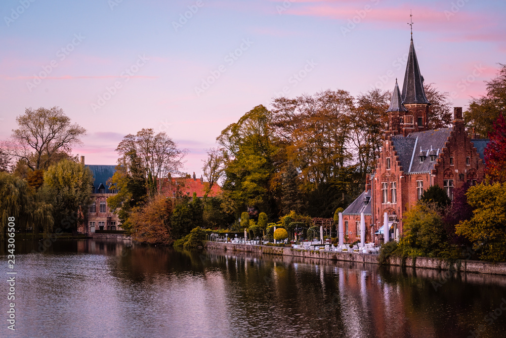 Buildings on river side in Belgium at sunset. 