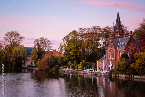 Buildings on river side in Belgium at sunset. 